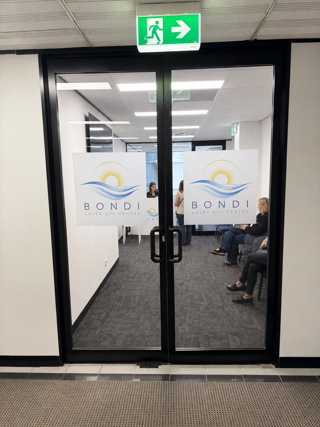 Glass entry doors with Bondi Laser Eye Centre signage